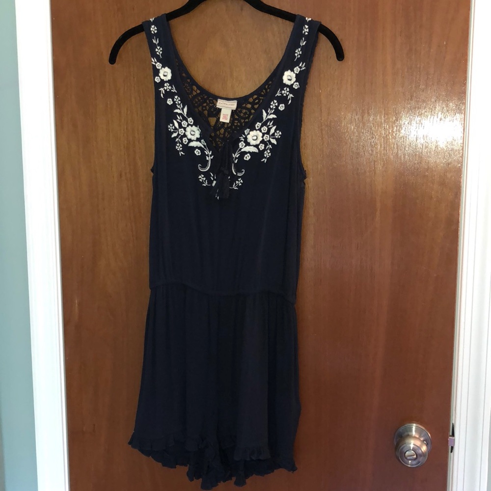 Navy romper with white flowers detail